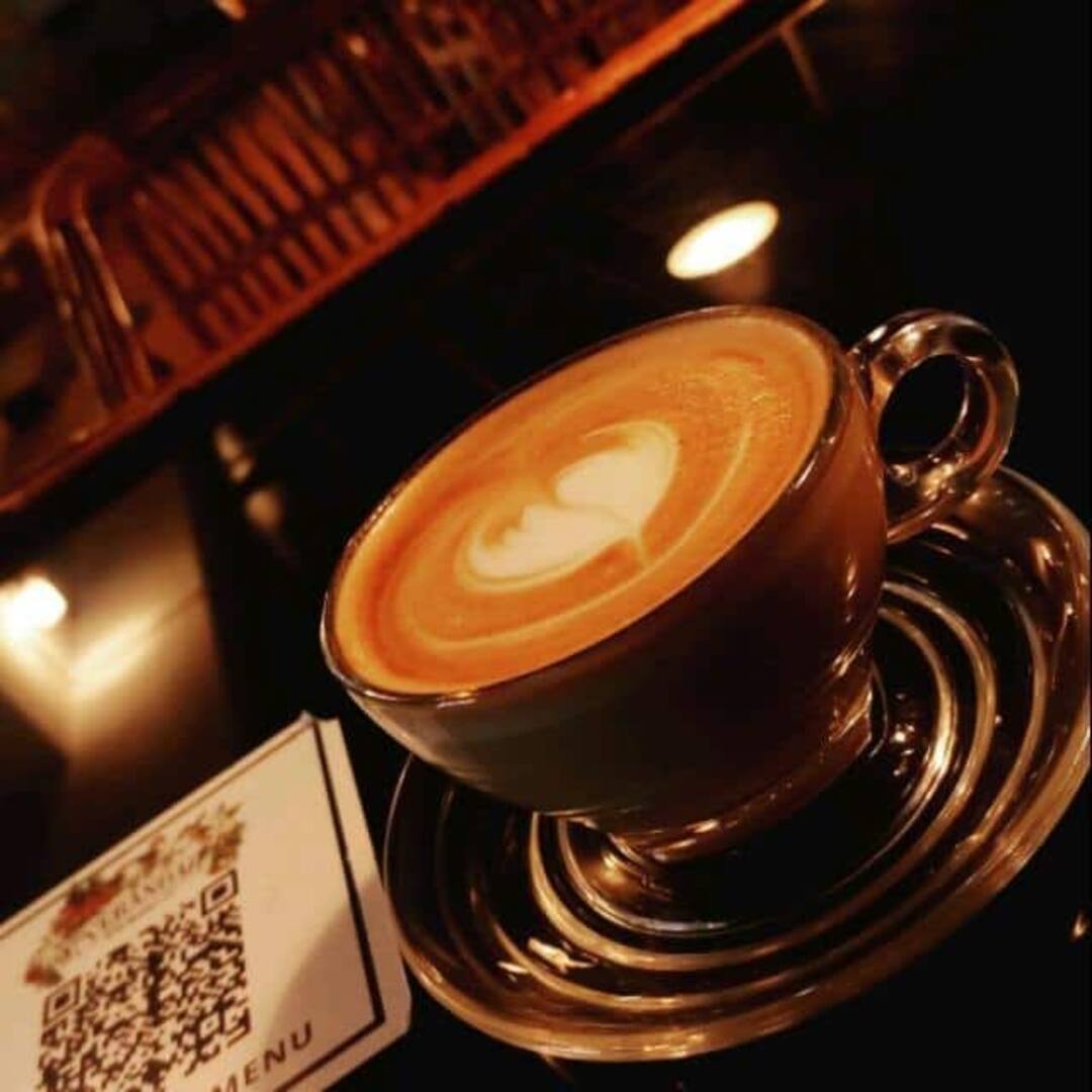House cappuccino with latte art, poured at Verandah
