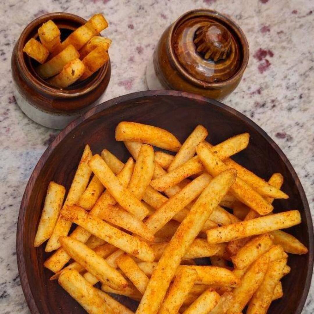 Fries plated with the house clay jars